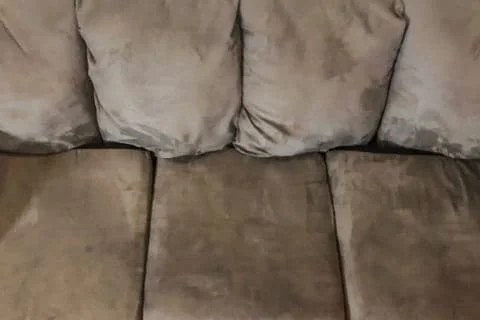 Can I use water to clean my fabric sofas