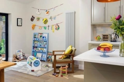 Make use of the houses corner space to create a little play area for kids.