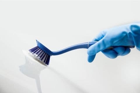 Scrub the stains with a soft brush