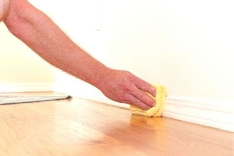 Clean baseboards with dryer sheets