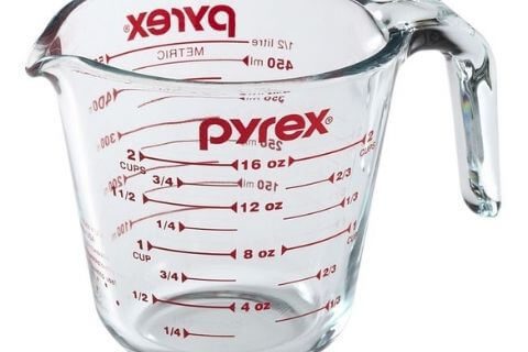 Measuring-bleach-using-a-measuring-cup