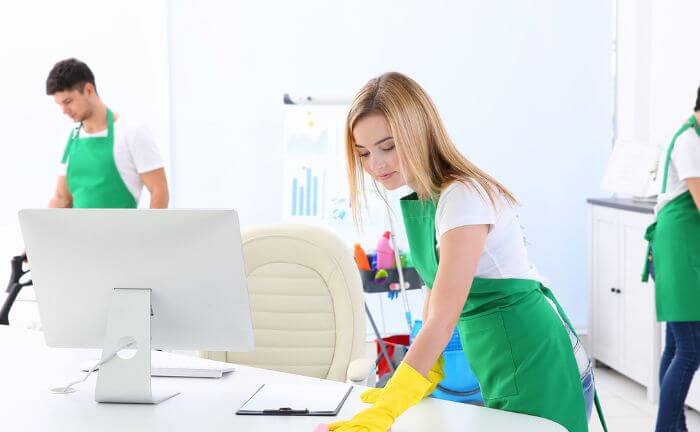 Office cleaning staffs do their tasks in corporation which is large