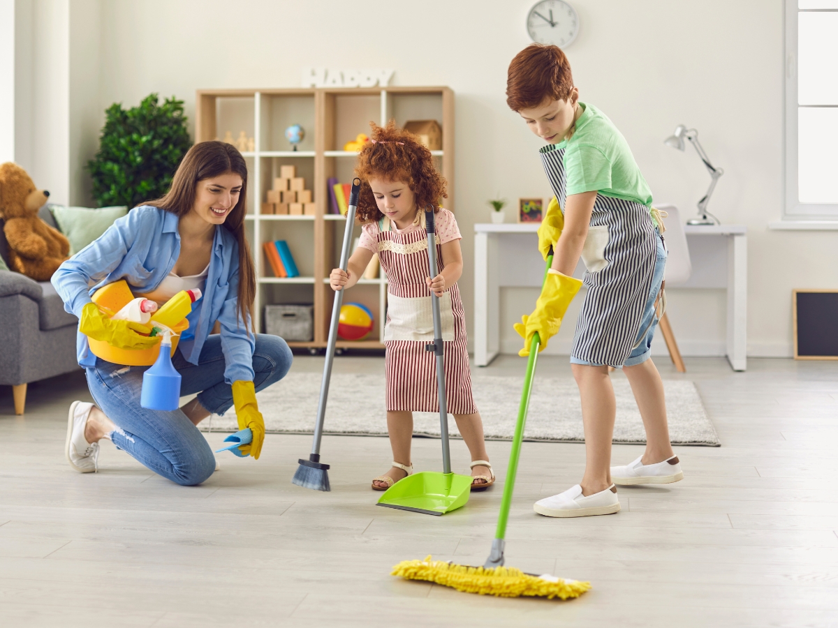 Children helping their mom to clean the house