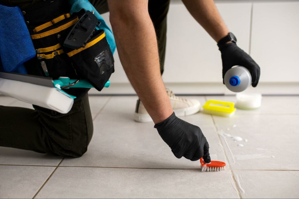 Cleaning the grout with a toothbrush (Source: Internet)